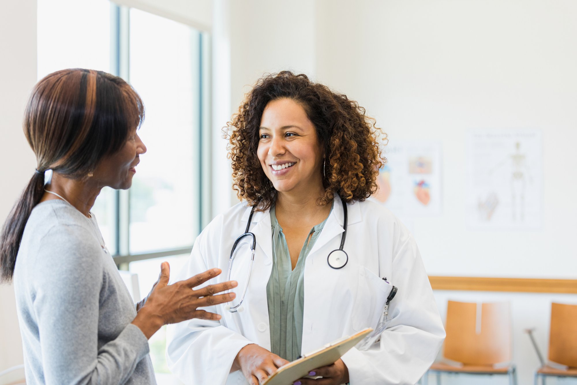 Doctor and patient discuss medical records.